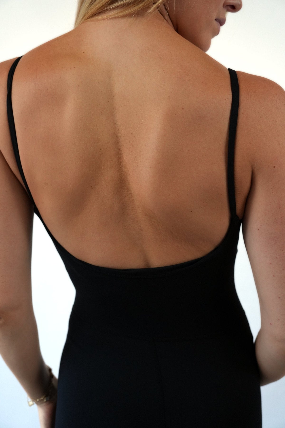 The Signature One Piece in Black, open back detail