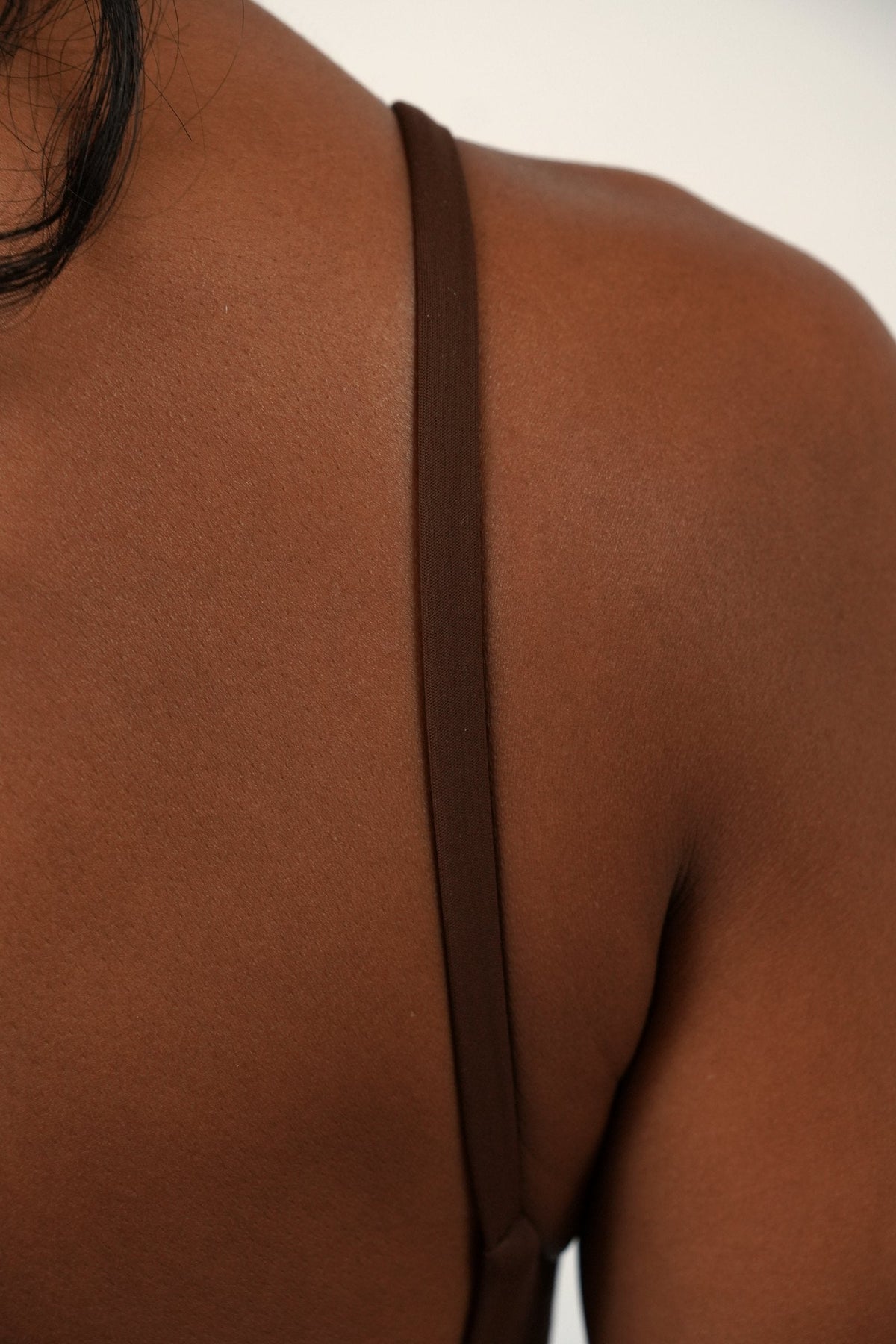 The Signature One Piece in Brown, back strap detail