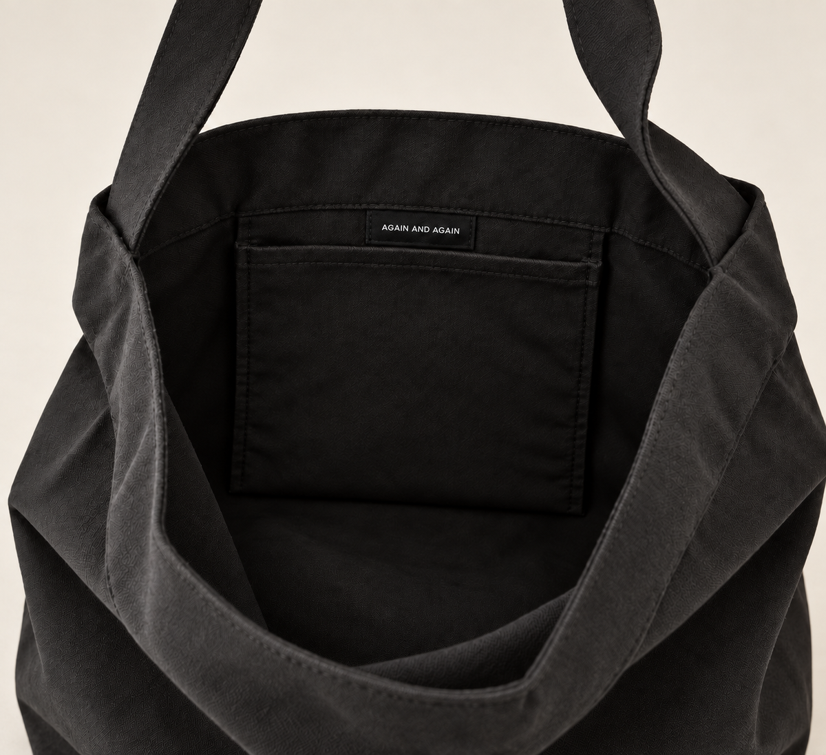The Tote in black, inside pocket